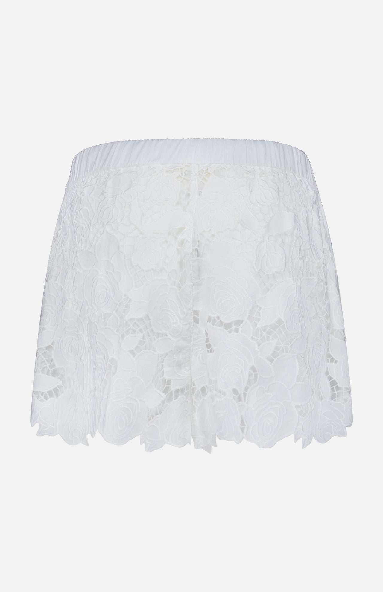 The Laina Pull On Eyelet Short by L'AGENCE features a floral eyelet design, elastic waistband, and scalloped edges, shown on a simple light background.