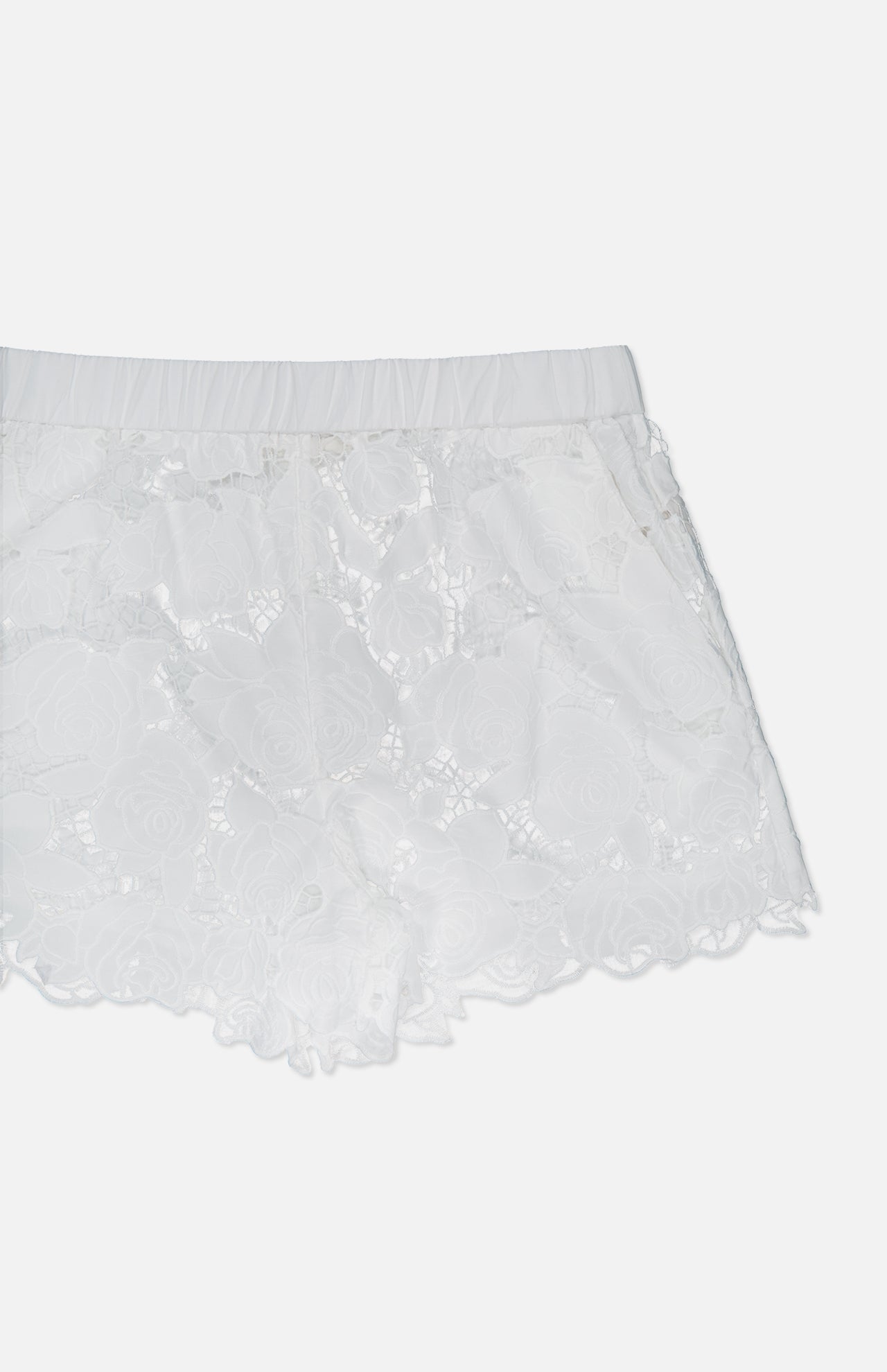 The L'AGENCE Laina Pull On Eyelet Short features a floral pattern, elastic waistband, cotton lining, and comfortable pull-on style, displayed against a plain light background.