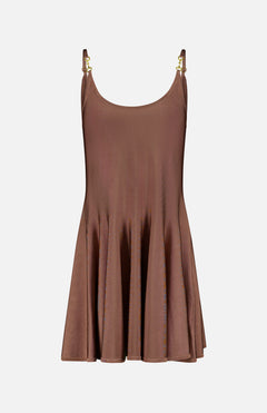 The Lana Flare Horsebit Knit Dress by L'AGENCE is a sleeveless, light brown stretch dress with a flared silhouette, thin shoulder straps, and gold-tone hardware accents, shown against a white background.