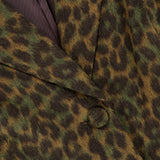 Close-up of a L’Agence Laney Leopard Print Coat in dark green and brown, featuring a notched lapel and covered buttons.