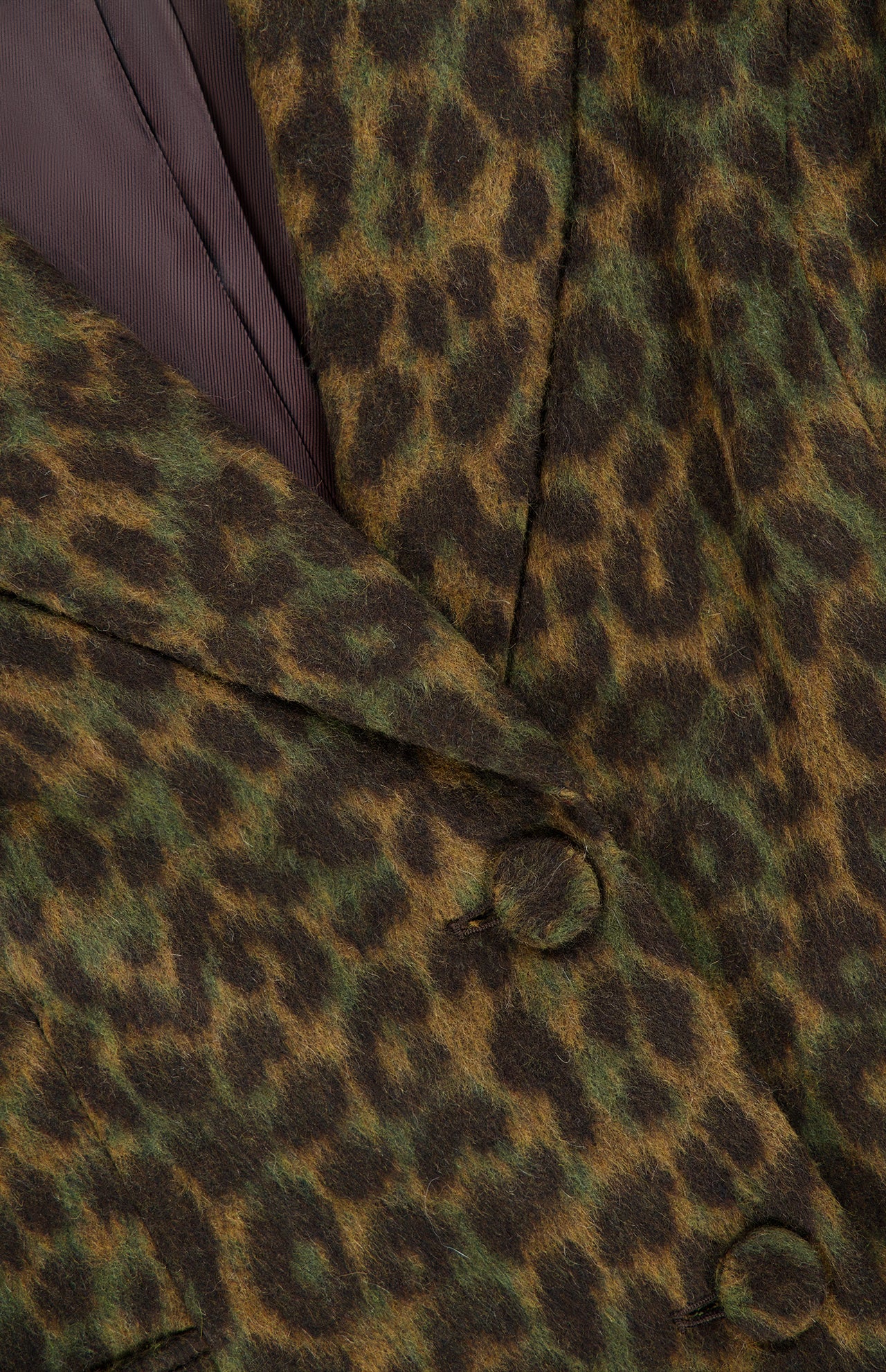 Close-up of a L’Agence Laney Leopard Print Coat in dark green and brown, featuring a notched lapel and covered buttons.
