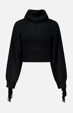 L’Agence Maddison Fringe Turtleneck Sweater in black, featuring a cropped knit bodice, long sleeves, and fringe detailing at the cuffs.