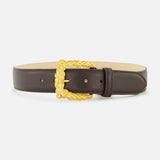 L’Agence Marcaeu Baroque Belt in chocolate brown leather, featuring an ornate, gold-tone statement buckle with an embossed scrolling pattern.