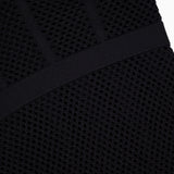 Close-up of the Michelle Bra Cup Pointelle Dress by L'AGENCE, featuring black textured mesh with a geometric pattern and solid diagonal bands—signature details of this dress’s structured sweetheart neckline.