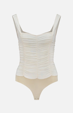 The L'AGENCE Mixie Ruched Bodysuit features vintage white mesh with wide straps, a square neckline, and snap-button crotch closure. Its upper is textured and gathered, while the lower part is smooth beige.