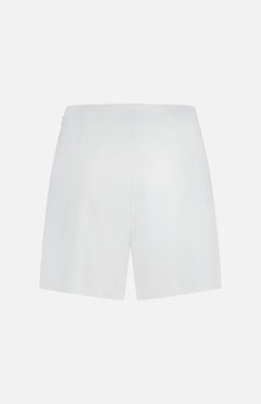 Back view of the L'AGENCE Naamah Pleated Stretch Short in white, shown against a white background. These wrinkle-resistant shorts feature a smooth texture, minimal design, and no visible pockets—ideal for resort wear.