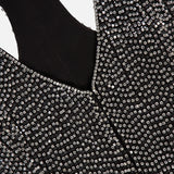 L’Agence Nixe Embellished Vest in black, sleeveless and covered in rows of round, clear crystals.