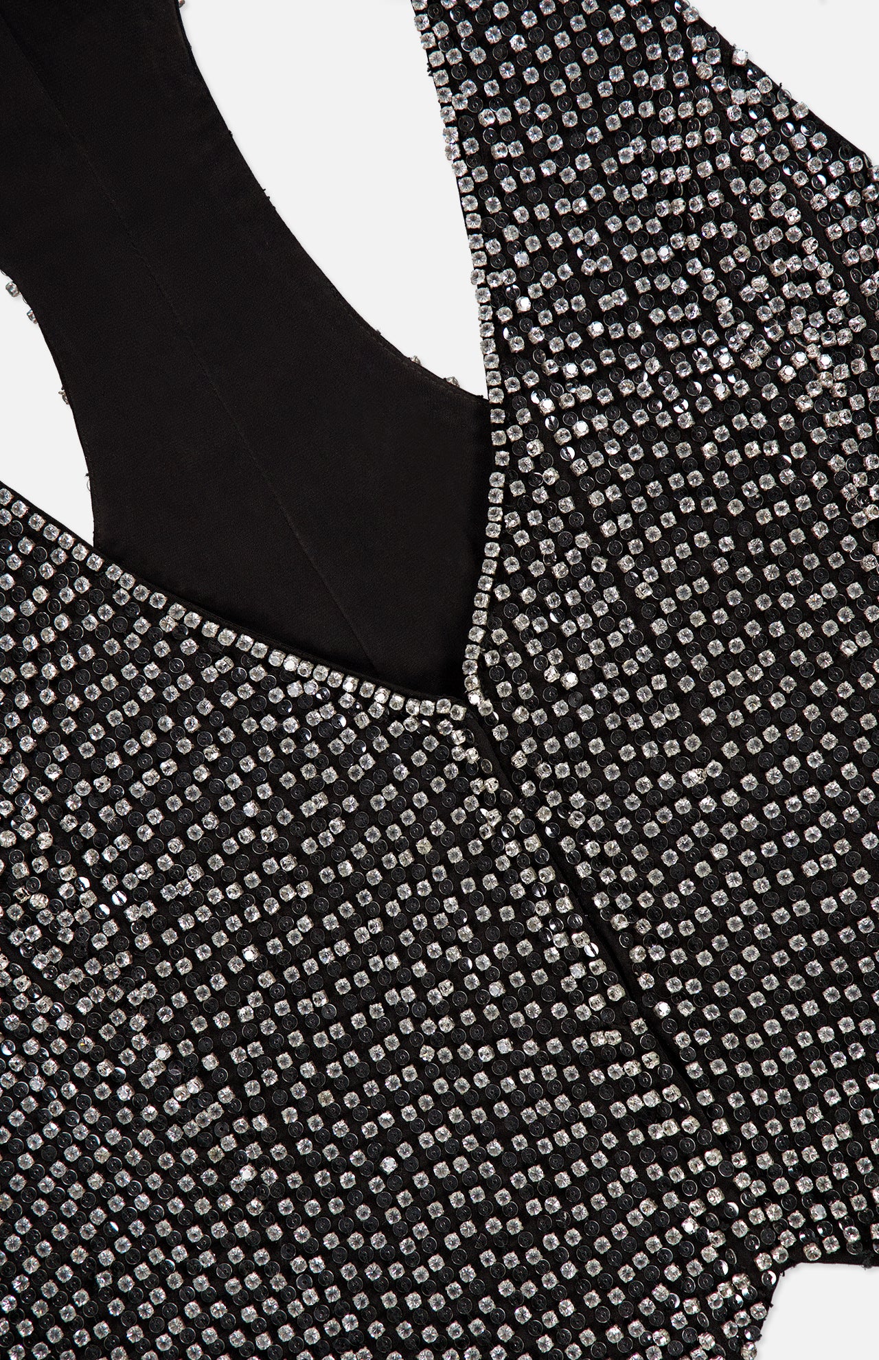 L’Agence Nixe Embellished Vest in black, sleeveless and covered in rows of round, clear crystals.