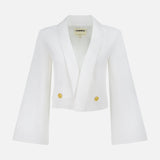 The L'AGENCE Nixie Wide Sleeve Cardigan Jacket in ivory features a cropped silhouette, wide flared sleeves, wide lapels, and two gold buttons on the front, shown against a plain white background.