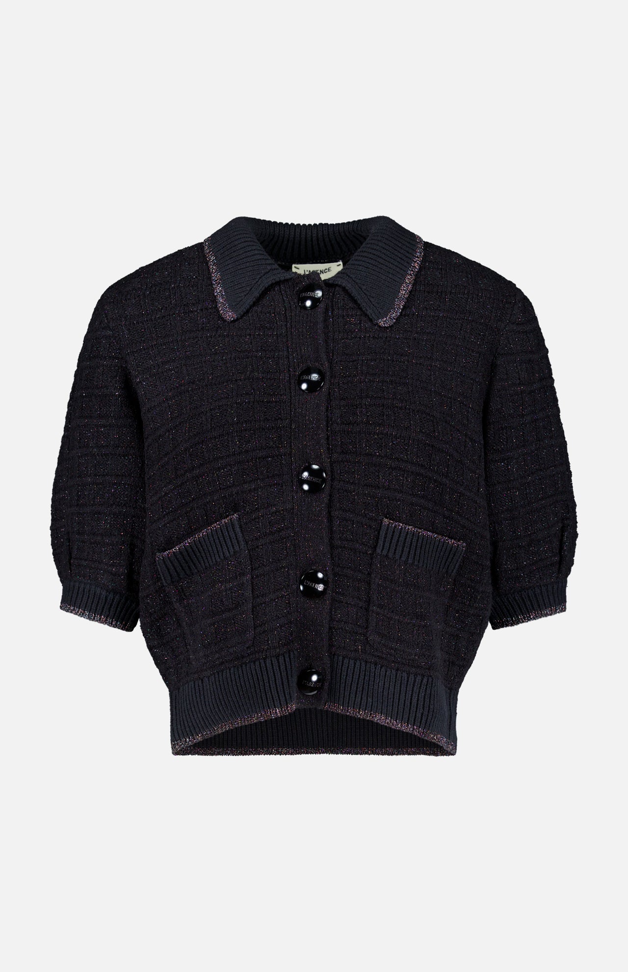 The Novalie Waffle Stitch Short Sleeve Cardigan by L’AGENCE features a short-sleeved, black textured knit design with a collar, large black buttons down the front, and two front pockets—offering effortless feminine style to any outfit.