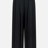 The Novalynn Cropped Pleated Pant by L'AGENCE features a wide-leg silhouette, high rise, and front pleats, shown here in black against a plain white background.