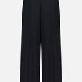 The Novalynn Cropped Pleated Pant by L'AGENCE is shown from the back in black, featuring a high rise and straight, wide-leg fit with a minimalist design against a plain white background.