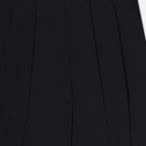 Close-up of the Novalynn Cropped Pleated Pant by L'AGENCE, featuring a black high-rise waistband, vertical pleats, smooth tailored fabric, and a small rectangular gold label at the waistband.