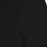 Close-up view of the L'AGENCE Novalynn Cropped Pleated Pant in black, laid flat to display the waistband and upper leg with a sharp center crease.