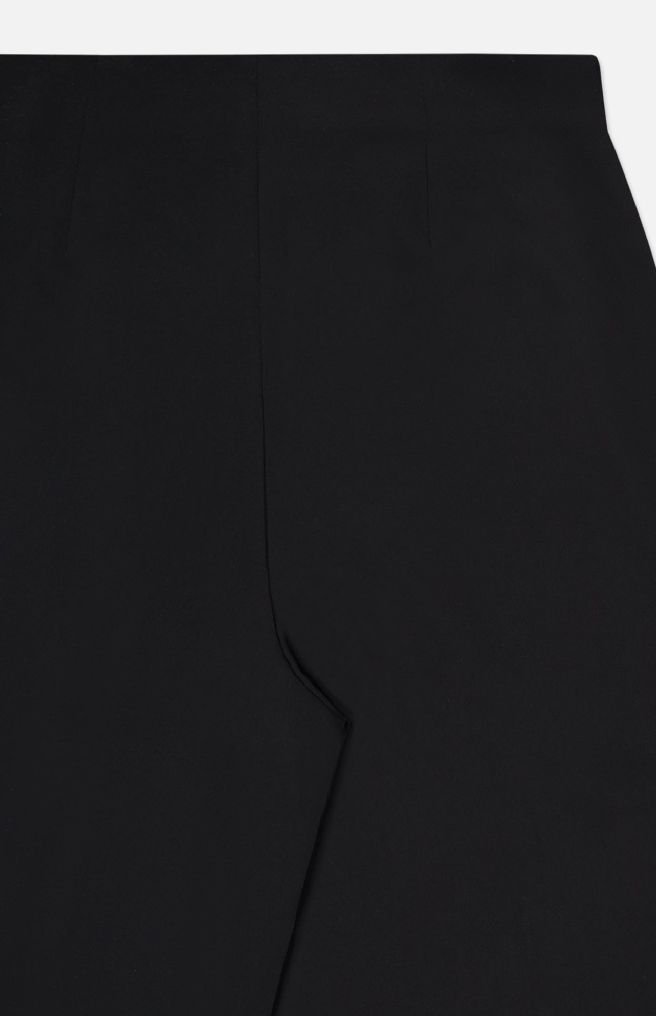 Close-up view of the L'AGENCE Novalynn Cropped Pleated Pant in black, laid flat to display the waistband and upper leg with a sharp center crease.