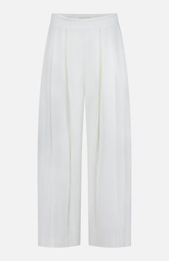 The Novalynn Cropped Pleated Pant by L'AGENCE features a white wide-leg, high-rise silhouette with front pleats and a minimalist design. Crafted from smooth, slightly shiny fabric for a polished, elegant look.