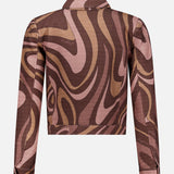 Back view of the Nyx Cropped Swirl Print Jacket by L’AGENCE, featuring long sleeves and an abstract swirl print in shades of brown, pink, and tan. This jacket is finished with a collar and has no visible fastenings.