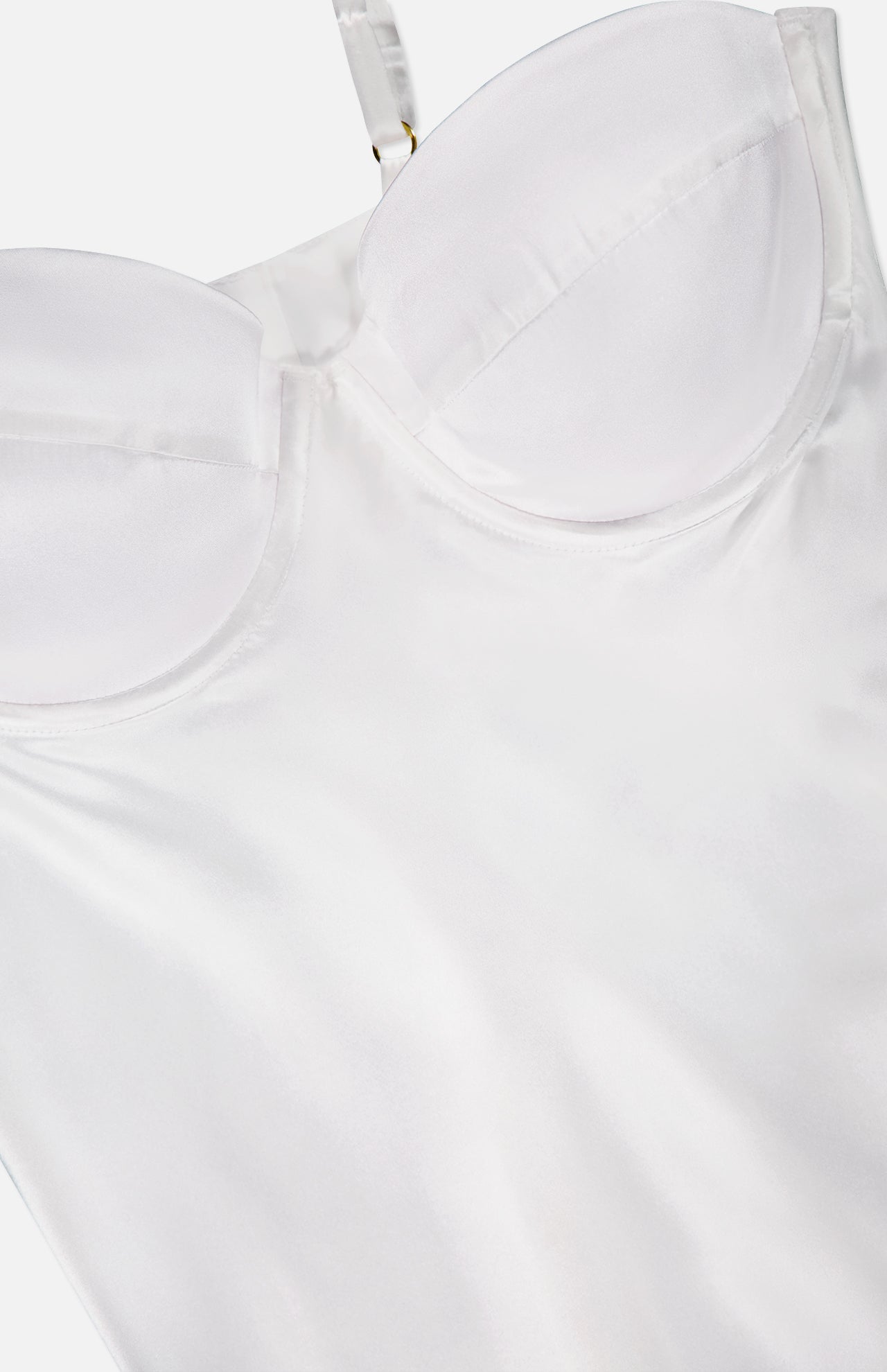 Close-up of the Orlina Silk Camisole Top by L'AGENCE in white satin, featuring underwire cups, adjustable transparent straps, smooth shiny fabric, and defined cup stitching.