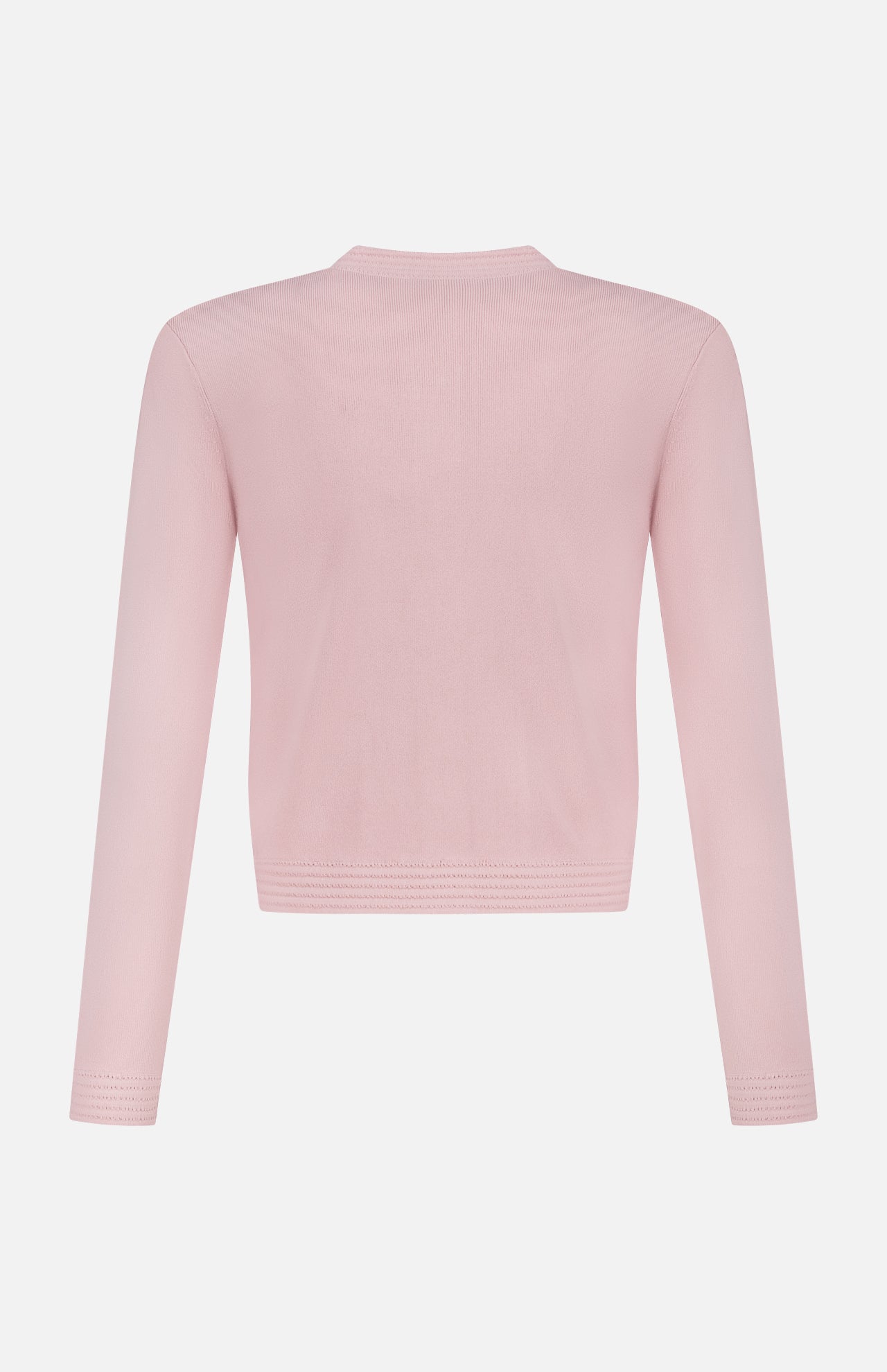 The Patsy Crop Crewneck Cardigan by L'AGENCE is a light pink, long-sleeve cardigan shown from the back, featuring a simple blush tone and plain design without visible patterns or embellishments.