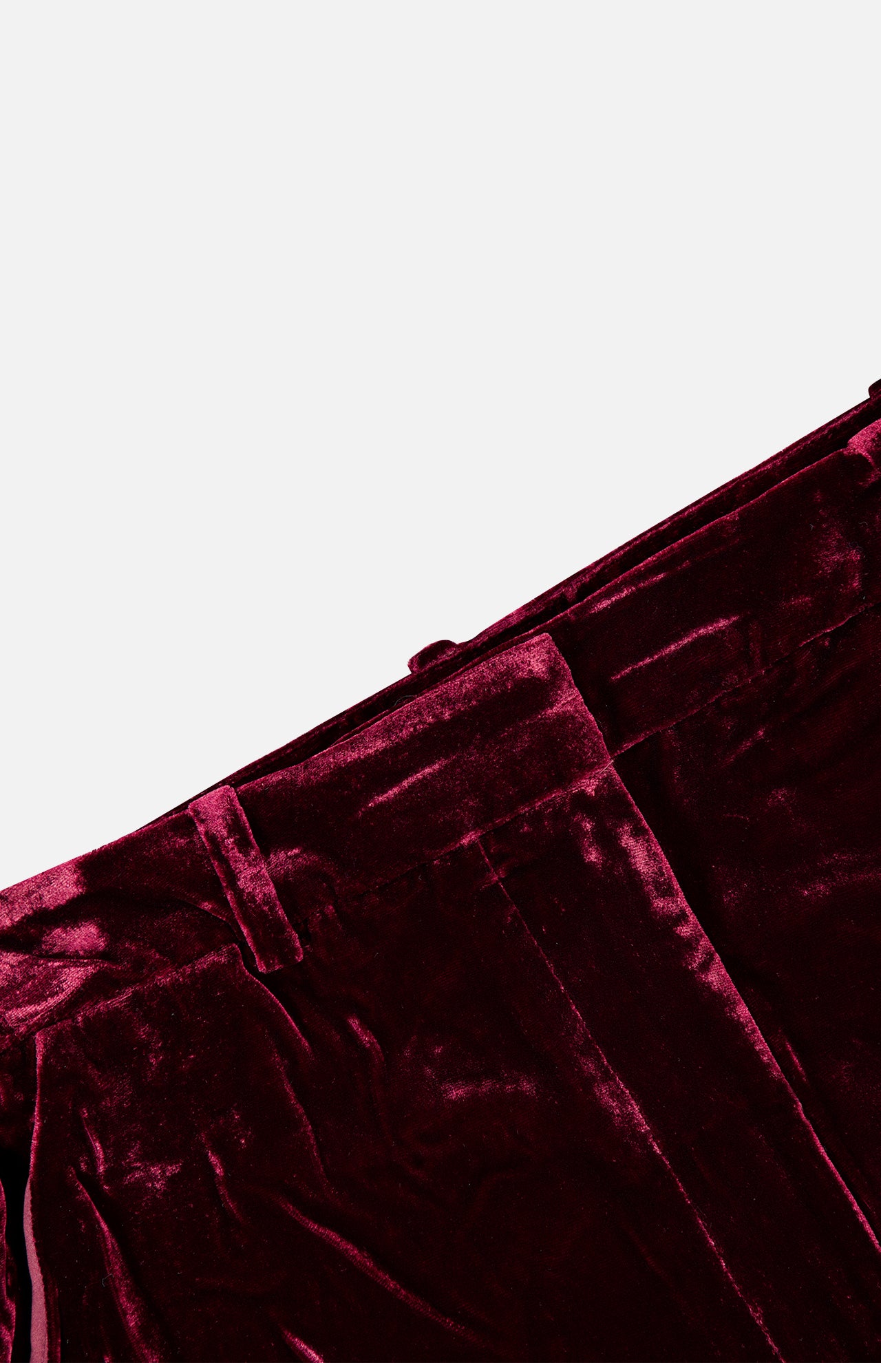 Deep red high-rise Pilar Wide Leg Velvet Trouser featuring a wide-leg silhouette and a waistband with belt loops.