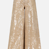 The Quincy Sequin High Rise Wide Leg Pant by L’AGENCE features a fully sequined beige design with statement wide legs, shown from the back against a plain white background.