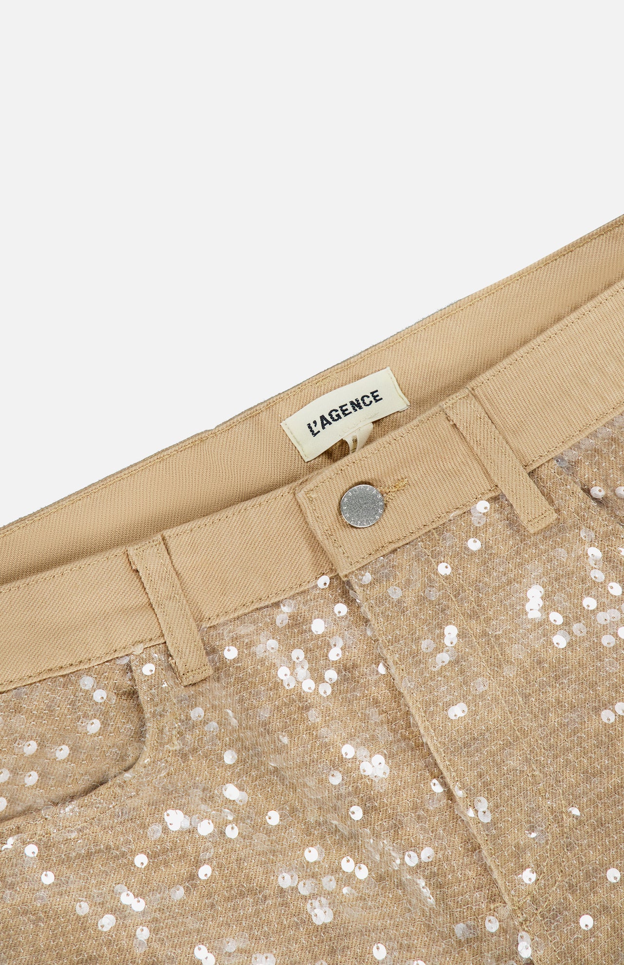 Close-up of Quincy Sequin High Rise Wide Leg Pant by L’AGENCE, featuring gold sequins, metal button, belt loops, and a label inside the waistband.