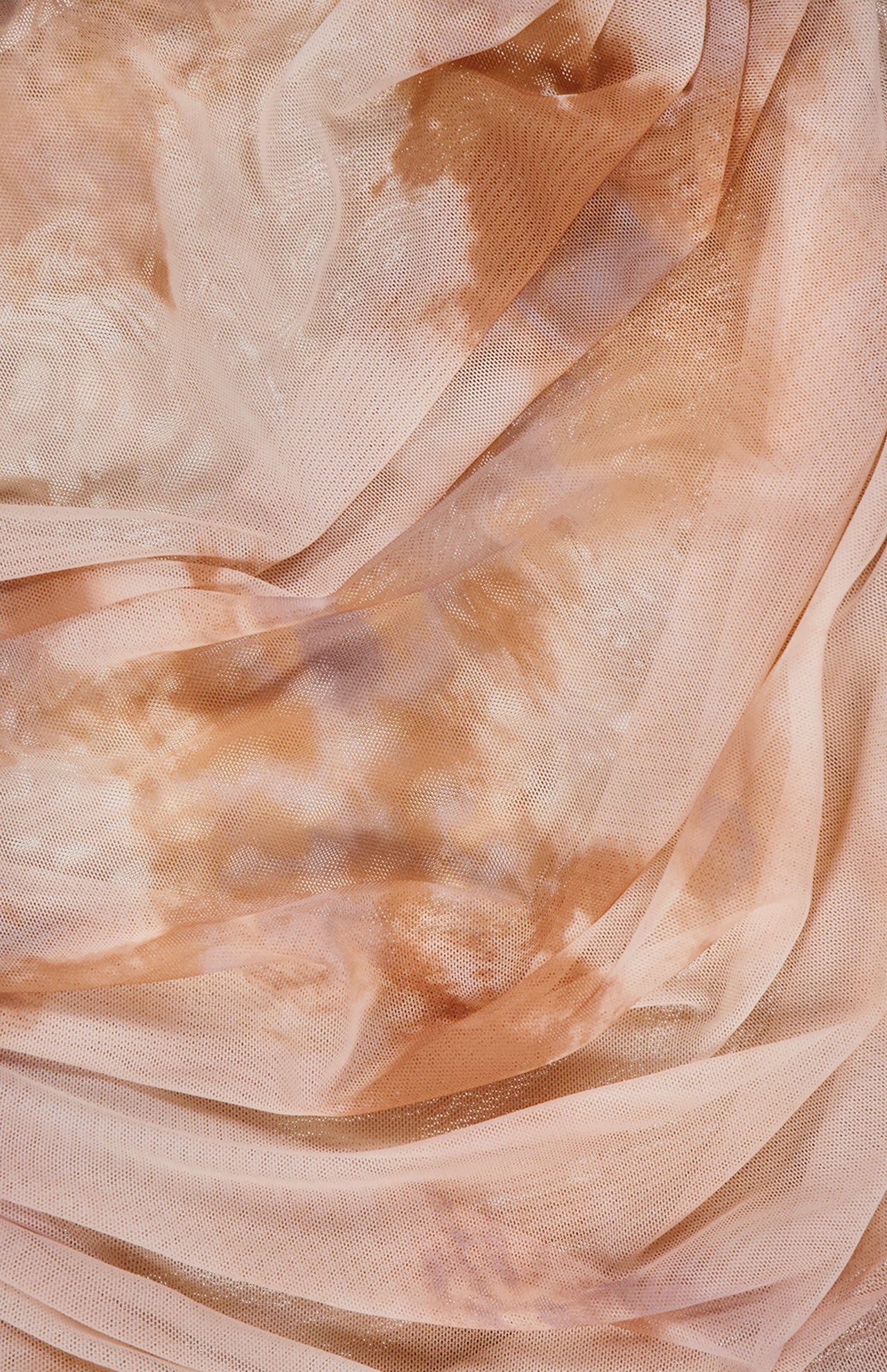 The L'AGENCE Rasha Shirred Abstract Print Tank features sheer, peach-colored stretch mesh with subtle brown and beige abstract patterns for a softly layered, textured look.