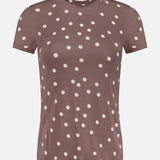 The Ressi Short Sleeve Crewneck Polka Dot T-shirt by L'AGENCE is a light brown, soft stretch jersey top with white polka dots and short sleeves.