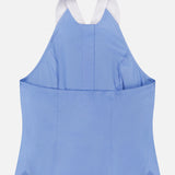 The Rina Collared Halter Top by L’AGENCE features a sleeveless, cornflower blue design with an open back, wide white neck strap, front button details, and straight hem for a modern take on the classic poplin shirt.