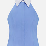 The Rina Collared Halter Top by L'AGENCE is a sleeveless cornflower blue poplin shirt with a fitted silhouette, contrasting white pointed collar, buttoned neck, open back, and tailored dress shirt-inspired style.