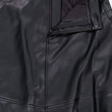 L’Agence Robyn Aline Midi Skirt in black vegan leather with a side zipper and a hook-and-bar closure at the waistband.