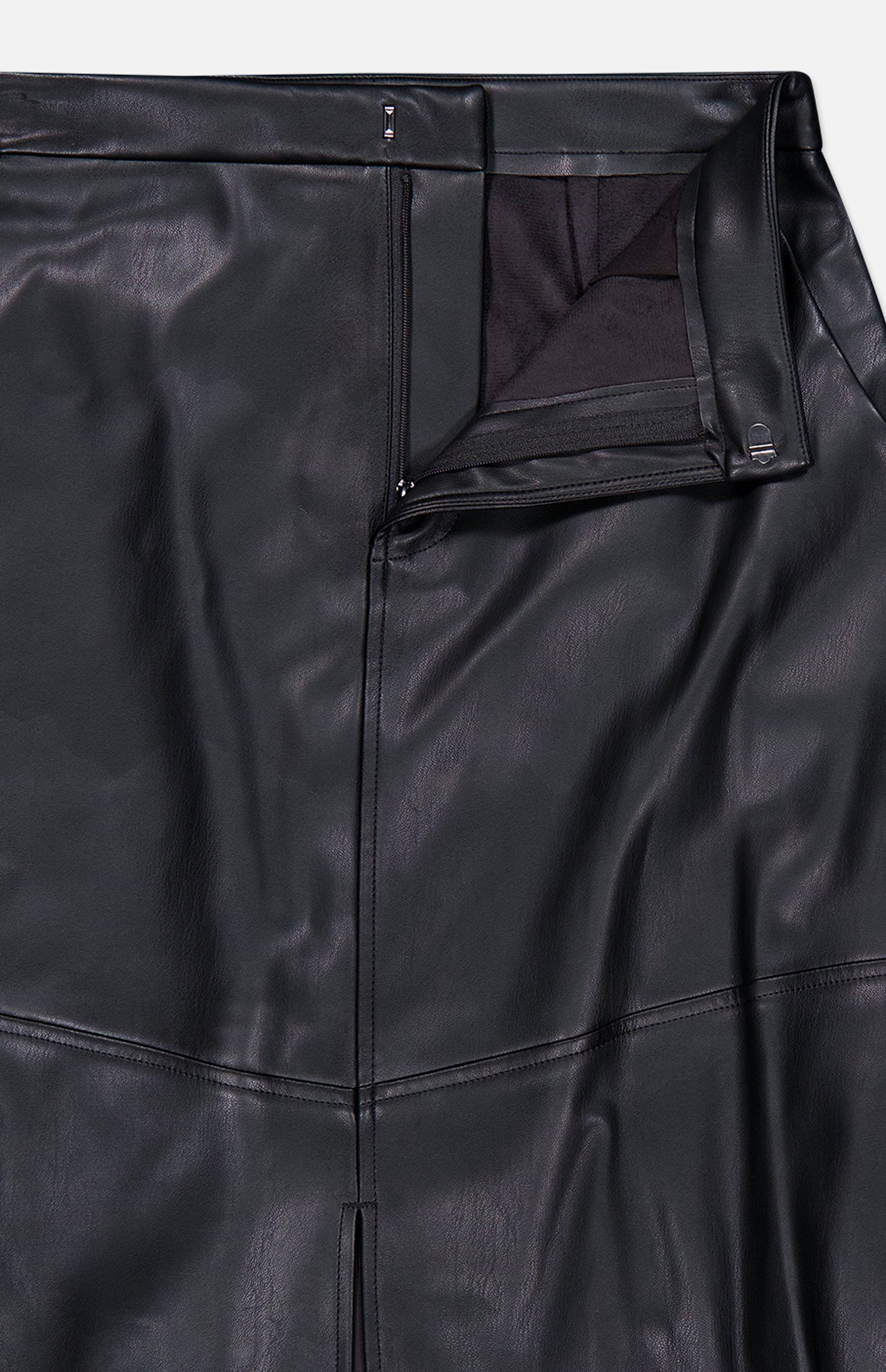 L’Agence Robyn Aline Midi Skirt in black vegan leather with a side zipper and a hook-and-bar closure at the waistband.