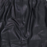 L’Agence Robyn Aline Midi Skirt in black vegan leather featuring a horizontal seam and high-waisted vertical pleats.
