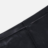 Close-up of the black vegan leather L’Agence Robyn Aline Midi Skirt, featuring a fitted waistband and a vertical seam.