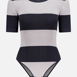 The Rosemond Crewneck Short Sleeve Bodysuit by L'AGENCE features wide black and light gray stripes, ribbed power stretch fabric, a crew neckline, snap bottom closure, and a contouring fit. Inside label reads L'AGENCE.