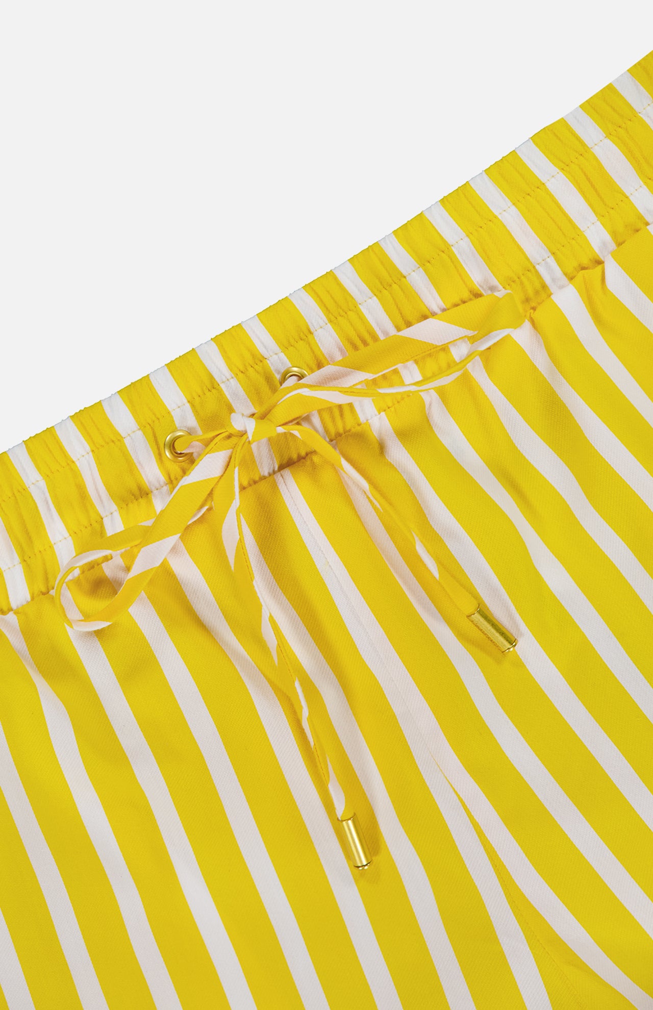 Close-up of Royce Drawstring Stripe Short by L'AGENCE, featuring an elastic waistband with a drawstring finished with metal tips. Made from soft organic cotton for comfort.