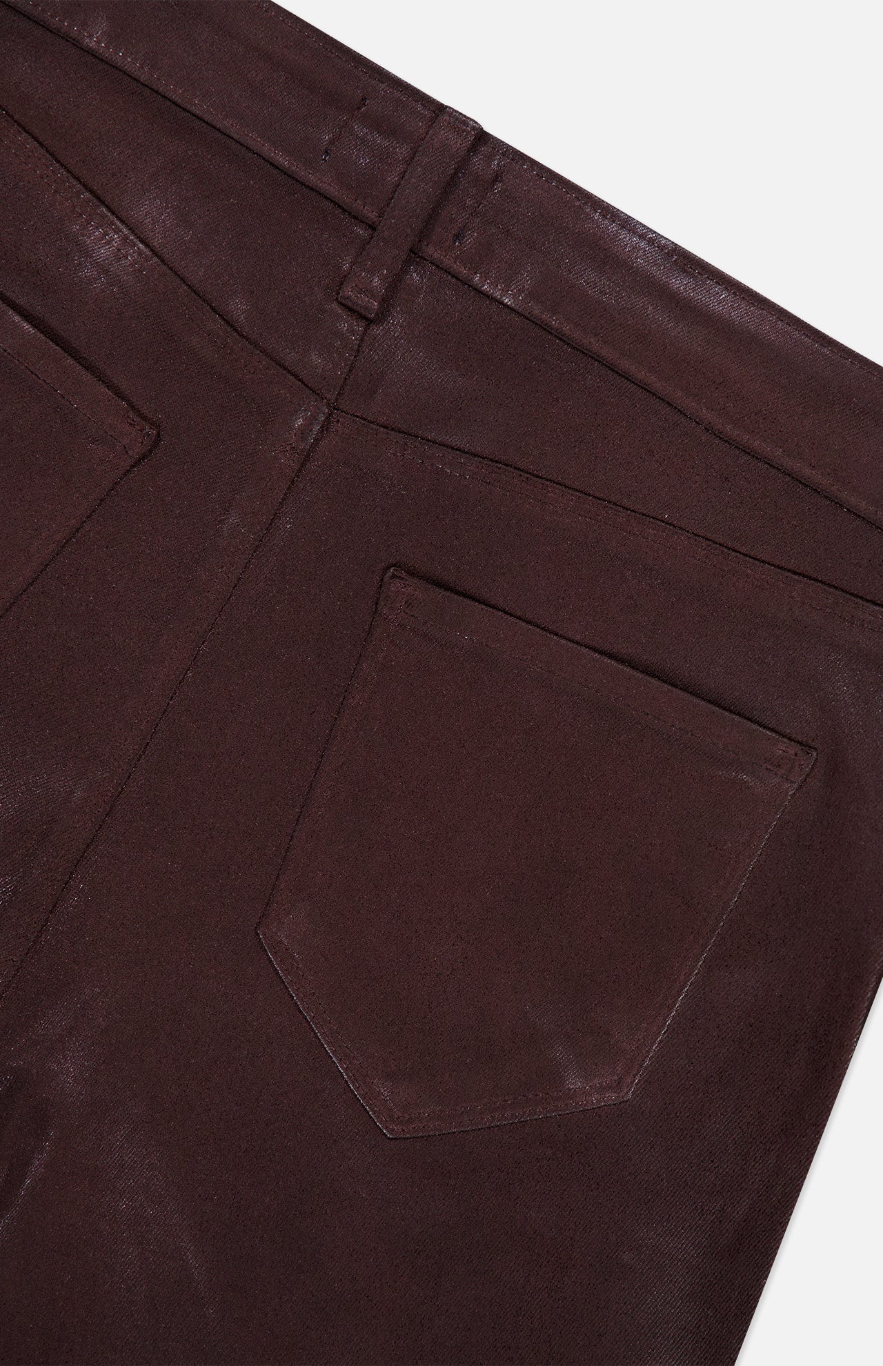 Close-up of the back of the L’AGENCE Ruth High Rise Straight Pant in dark brown, featuring a belt loop, waistband, and back pocket against a white background.