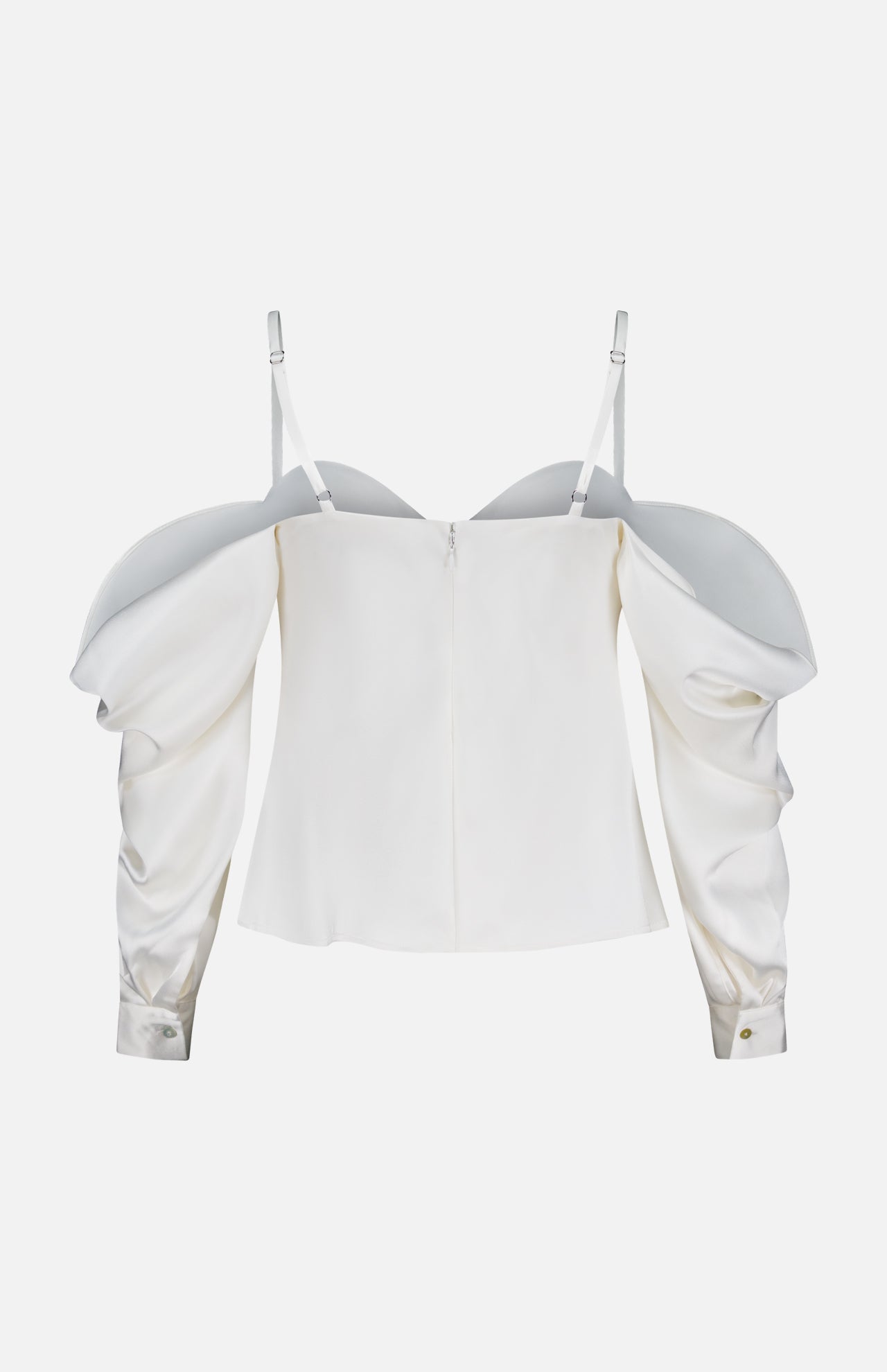 The Saya Cold Shoulder Draped Top by L'AGENCE is an off-white satin blouse featuring dramatic puffed sleeves, thin adjustable straps, a back zipper, subtle sheen, and fitted cuffs with small buttons—perfect for evening wear.