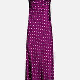L’Agence Sayla Bias Cut Maxi Dress in a dark plum shade, featuring a sweetheart neckline, thin shoulder straps, and a playful polka dot pattern.