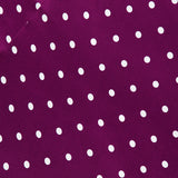 L’Agence Sayla Bias Cut Maxi Dress in deep purple fabric with a white polka dot pattern.