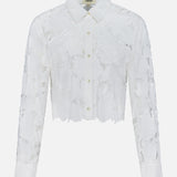 The Seychelle Cropped Button Down Shirt by L'AGENCE features sheer, white floral lace, long sleeves, a classic collar, and a cropped hem for an elegant look.