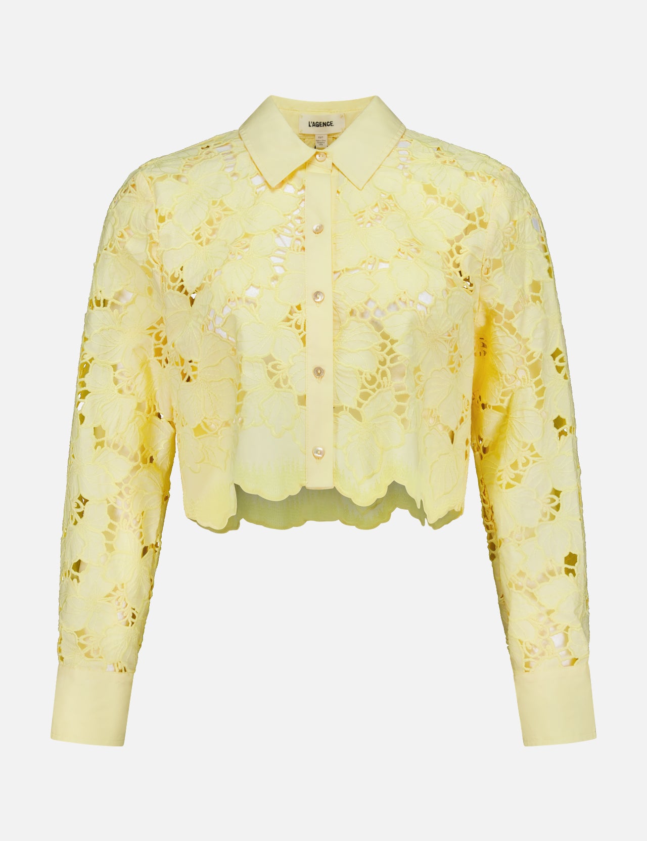 The Seychelle Cropped Button Down Shirt by L'AGENCE is a sheer yellow lace, long-sleeve, collared blouse with floral pattern—perfect as a light summer top.