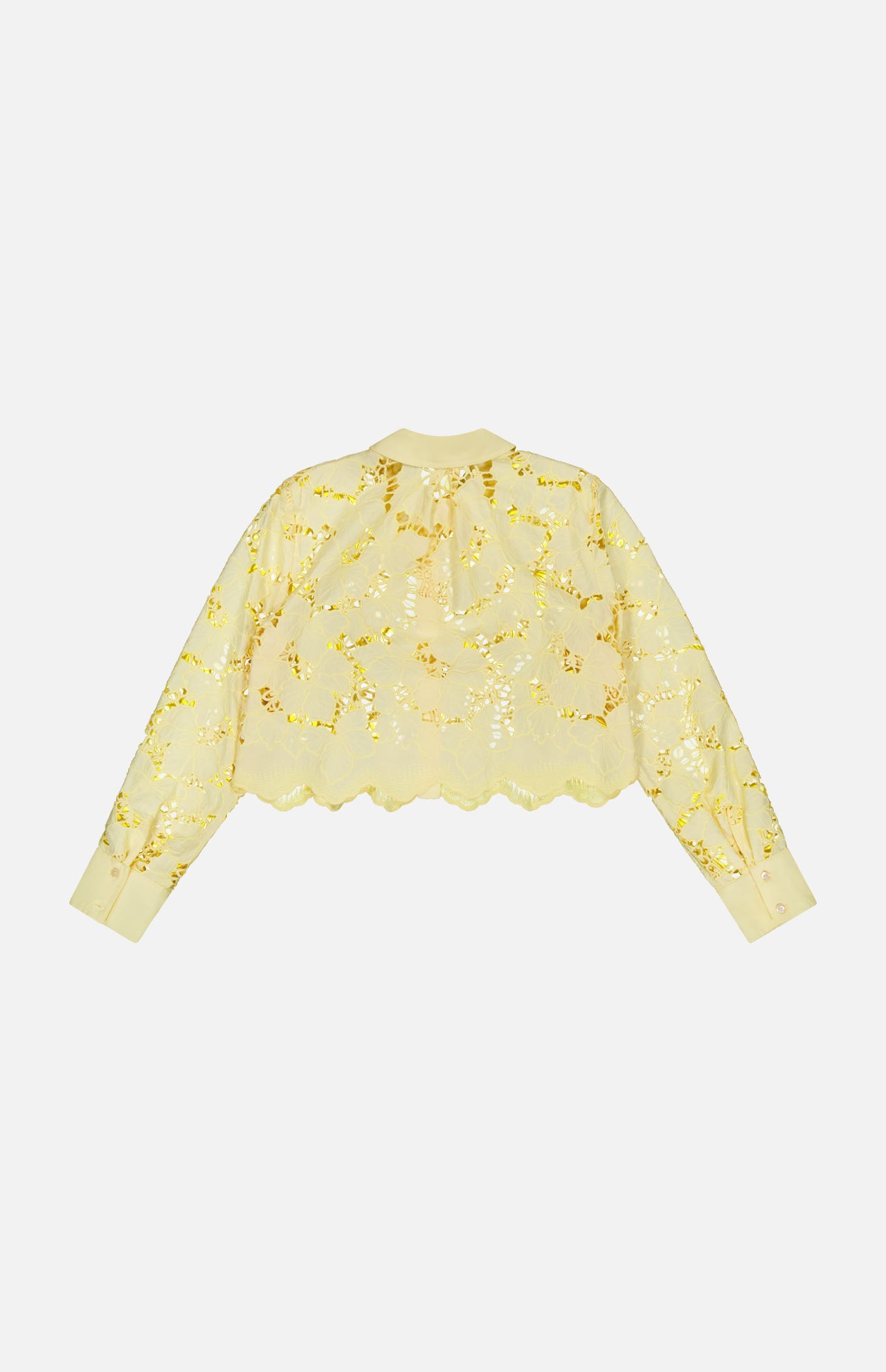 The Seychelle Cropped Button Down Shirt by L'AGENCE is a sheer, long-sleeved yellow blouse with gold floral embroidery and scalloped edges, shown flat on a white background in back view.
