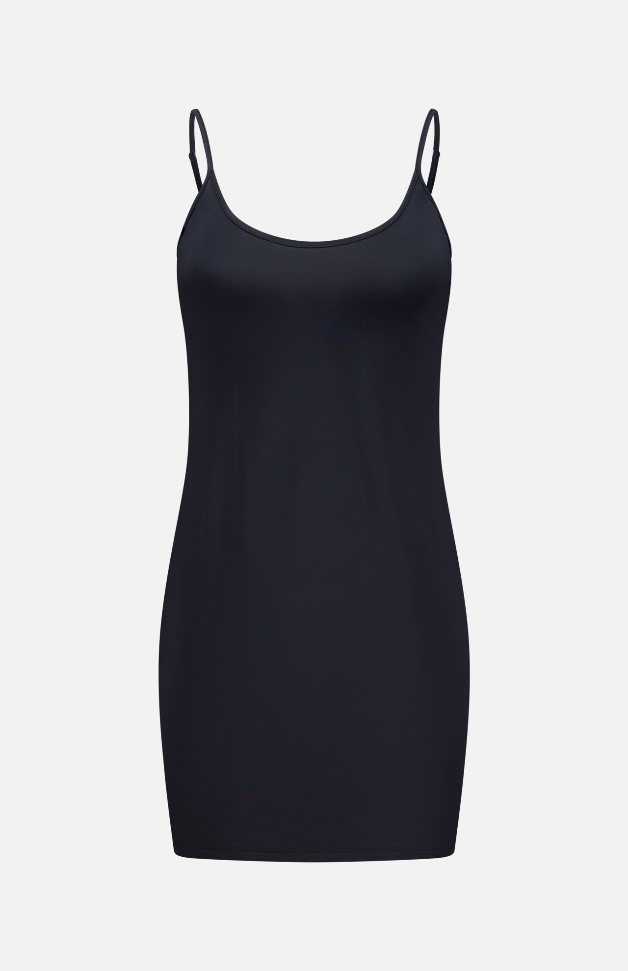 The L'AGENCE Slip Lining Mini Dress is a plain black stretch jersey dress with thin adjustable spaghetti straps, shown on a white background.