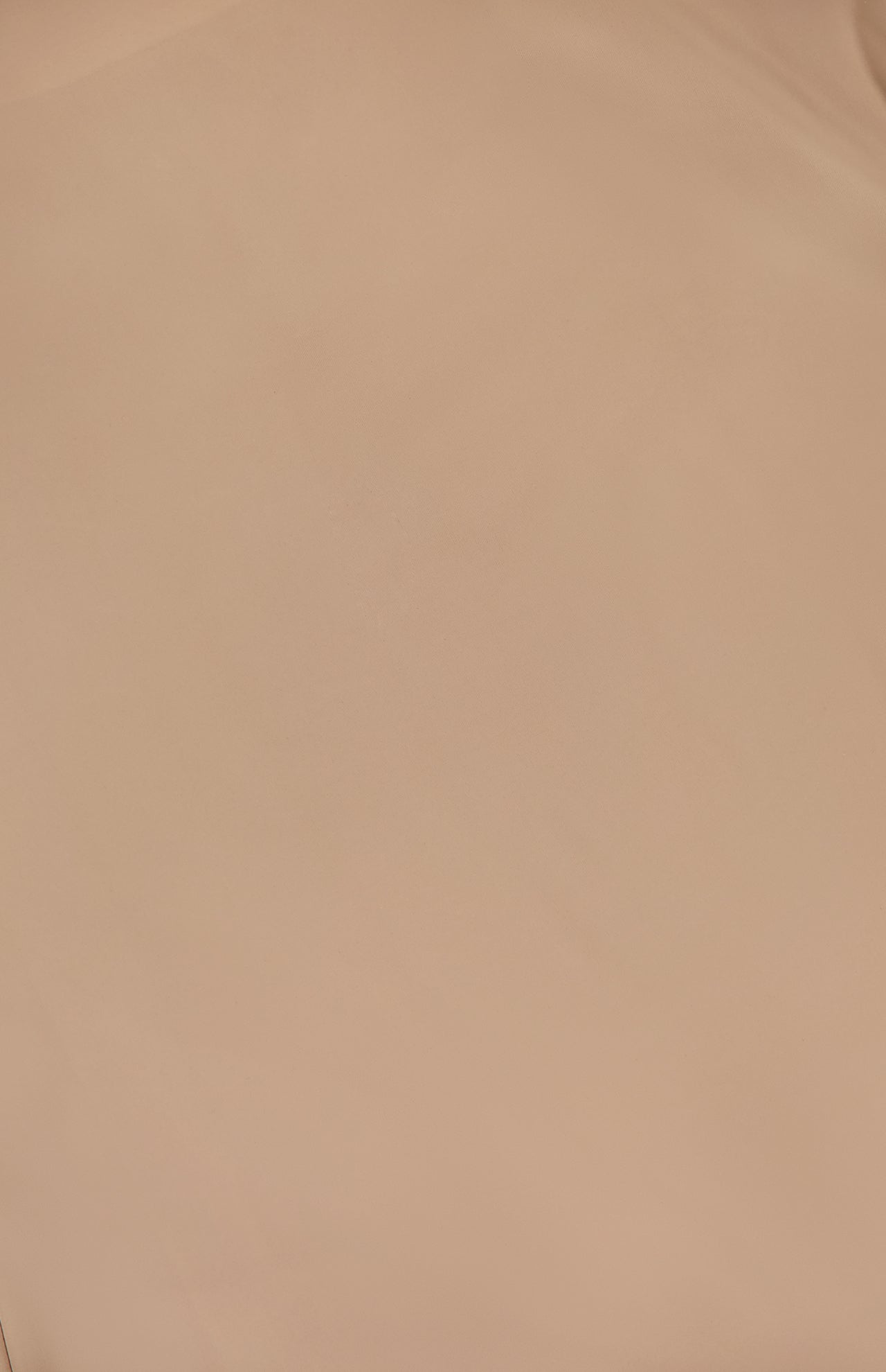 The Slip Lining Mini Dress by L'AGENCE features a smooth, light brown surface with subtle shading and gentle creases, evoking the soft texture of a nude slip lining.