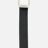Introducing the Solera Engraved Plaque Belt by L’AGENCE—a sophisticated black leather belt crafted from luxurious Italian calf hair. This elegant accessory features a rectangular, ornate silver buckle with intricate engraved details along the edges, making it the perfect pairing for your favorite silver pieces. Photographed against a plain white background, this belt adds a touch of refined style to any ensemble.