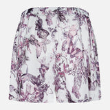 The L'AGENCE Sylie Butterfly Print Pull On Short features an elastic waistband, a pull-on design, and a white base with butterfly and floral prints in purple and pink.