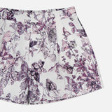 The Sylie Butterfly Print Pull On Short by L'AGENCE features a purple and pink butterfly print, pleats, an elastic waistband, and an easy pull-on design. Displayed flat against a white background.