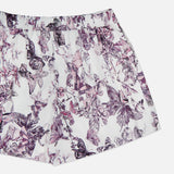 The Sylie Butterfly Print Pull On Short by L'AGENCE features a purple and black butterfly with a floral motif on white. These effortless summer shorts offer easy pull-on styling, perfect for showcasing your style.