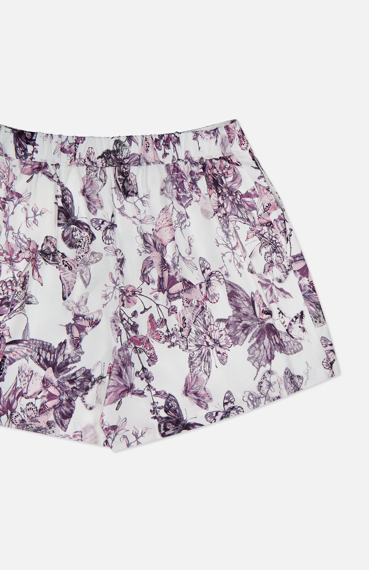 The Sylie Butterfly Print Pull On Short by L'AGENCE features a purple and black butterfly with a floral motif on white. These effortless summer shorts offer easy pull-on styling, perfect for showcasing your style.